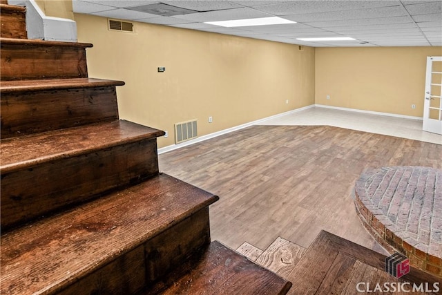 161 Pinecrest Ter, Athens, GA 30606 - stairway featuring a drop ceiling, baseboards, and wood finished floors