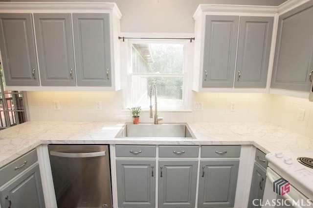 1851 Harvest Way, Loganville, GA 30052 - kitchen featuring gray cabinetry, stainless steel dishwasher, a sink, and tasteful backsplash