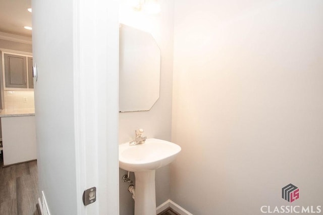 1851 Harvest Way, Loganville, GA 30052 - bathroom featuring crown molding, wood finished floors, and baseboards