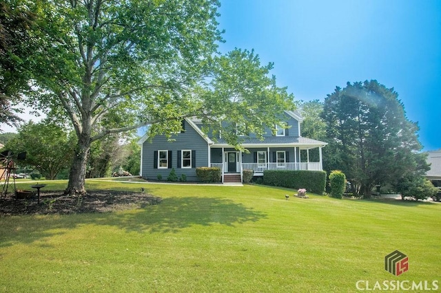 1851 Harvest Way, Loganville, GA 30052 - view of front of house featuring covered porch and a front yard