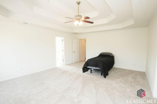 1851 Harvest Way, Loganville, GA 30052 - bedroom featuring a tray ceiling, ornamental molding, carpet flooring, and a ceiling fan