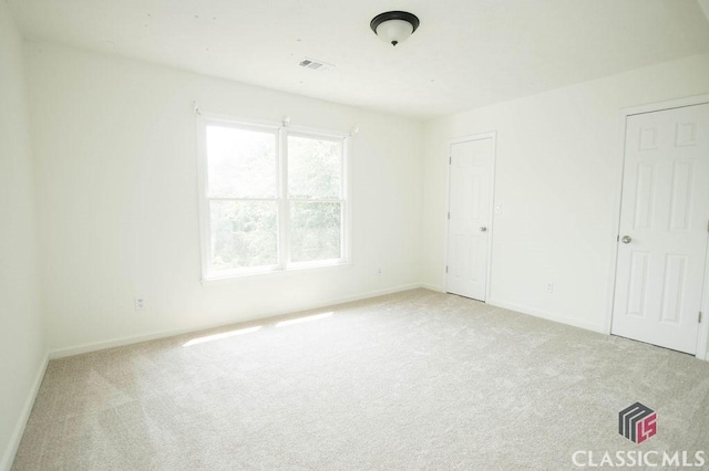1851 Harvest Way, Loganville, GA 30052 - unfurnished bedroom with light colored carpet and baseboards