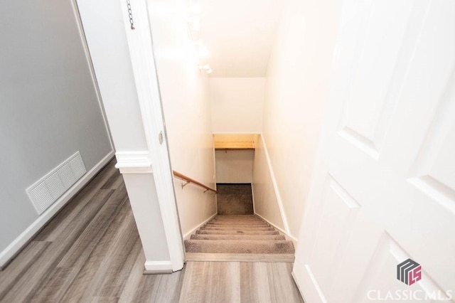 1851 Harvest Way, Loganville, GA 30052 - stairs with wood finished floors and baseboards