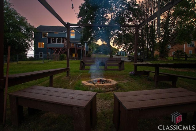 1851 Harvest Way, Loganville, GA 30052 - view of community with an outdoor fire pit and a wooden deck