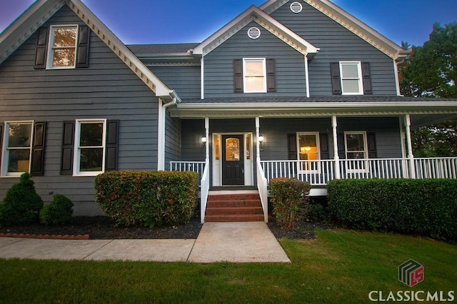 1851 Harvest Way, Loganville, GA 30052 - view of front of home featuring a front lawn and covered porch