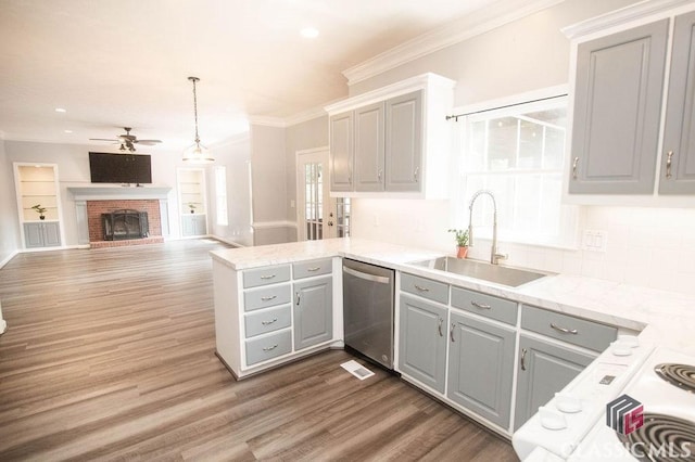 1851 Harvest Way, Loganville, GA 30052 - kitchen with stainless steel dishwasher, a sink, gray cabinets, ceiling fan, and a peninsula