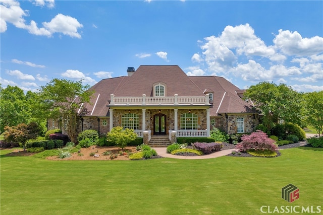 3881 Sims Bridge Rd, Monroe, GA 30656 - view of front of property featuring stone siding, a porch, and a front lawn