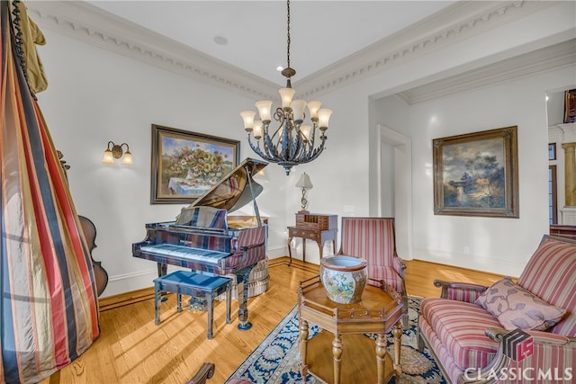 3881 Sims Bridge Rd, Monroe, GA 30656 - living area with a chandelier, ornamental molding, wood finished floors, and baseboards