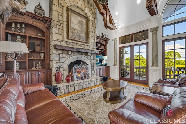 3881 Sims Bridge Rd, Monroe, GA 30656 - living room with a high ceiling, wood finished floors, and a fireplace