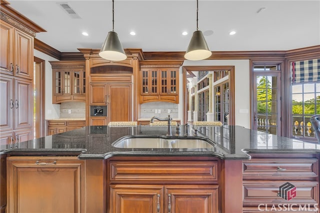 3881 Sims Bridge Rd, Monroe, GA 30656 - kitchen featuring a sink, tasteful backsplash, an island with sink, hanging light fixtures, and recessed lighting