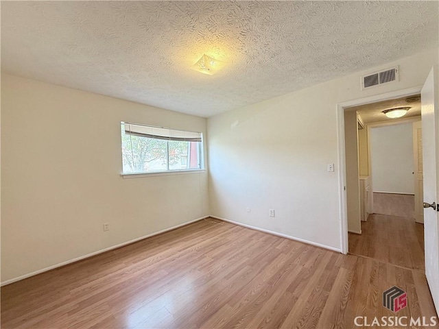 168 Scandia Cir, Athens, GA 30605 - unfurnished room with wood finished floors, a textured ceiling, and baseboards