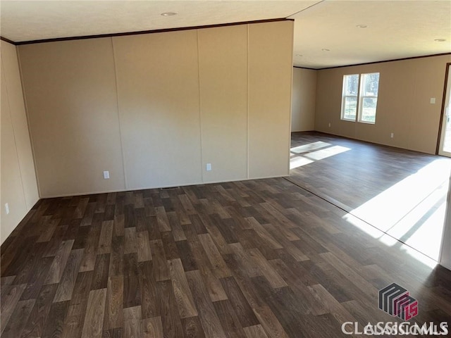 832 Stone Stewart Rd, Hull, GA 30646 - empty room featuring wood finished floors, ornamental molding, and a decorative wall