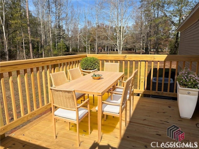 832 Stone Stewart Rd, Hull, GA 30646 - wooden terrace featuring outdoor dining area and view of wooded area