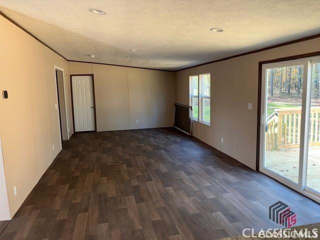 832 Stone Stewart Rd, Hull, GA 30646 - empty room with wood finished floors, crown molding, and recessed lighting