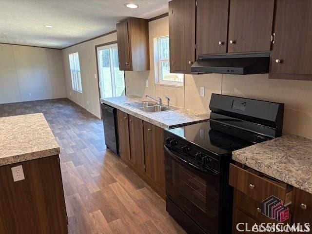832 Stone Stewart Rd, Hull, GA 30646 - kitchen featuring black electric range, dishwashing machine, under cabinet range hood, wood finished floors, and light countertops