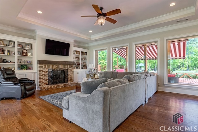 1641 Lane Creek Rd, Bogart, GA 30622 - living room with healthy amount of natural light, a raised ceiling, wood finished floors, crown molding, and recessed lighting
