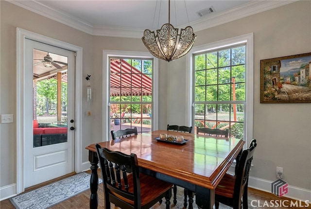1641 Lane Creek Rd, Bogart, GA 30622 - dining room featuring a chandelier, wood finished floors, baseboards, and crown molding