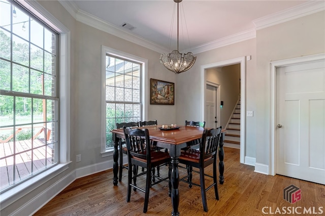1641 Lane Creek Rd, Bogart, GA 30622 - dining room featuring a chandelier, light wood-style floors, baseboards, crown molding, and stairway