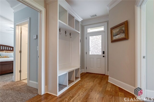 1641 Lane Creek Rd, Bogart, GA 30622 - mudroom with light wood-type flooring, crown molding, and baseboards