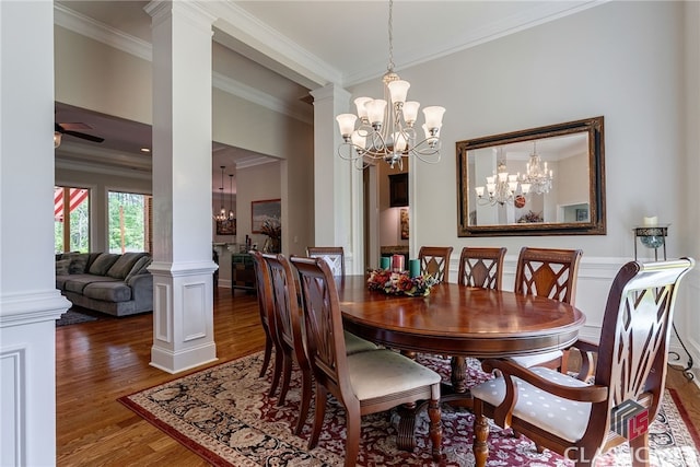 1641 Lane Creek Rd, Bogart, GA 30622 - dining room featuring decorative columns, a chandelier, wood finished floors, and crown molding