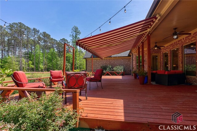 1641 Lane Creek Rd, Bogart, GA 30622 - wooden terrace with outdoor lounge area, ceiling fan, and outdoor dining space