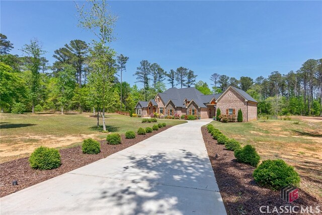 1641 Lane Creek Rd, Bogart, GA 30622 - view of front of home with a front yard, stone siding, and concrete driveway