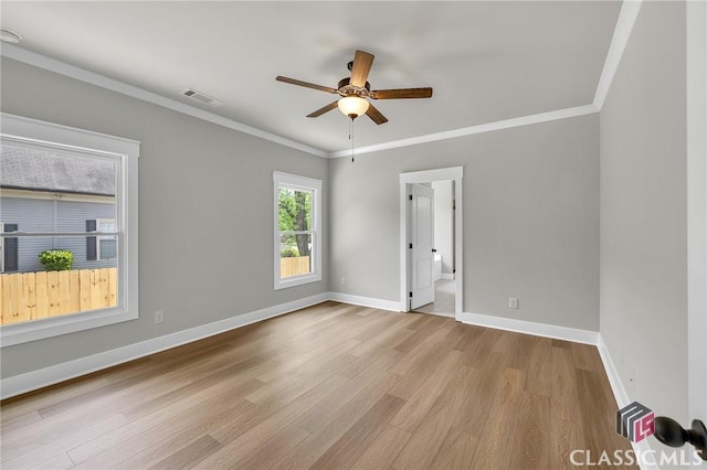 231 Marable St E, Monroe, GA 30655 - spare room featuring a ceiling fan, wood finished floors, baseboards, and ornamental molding