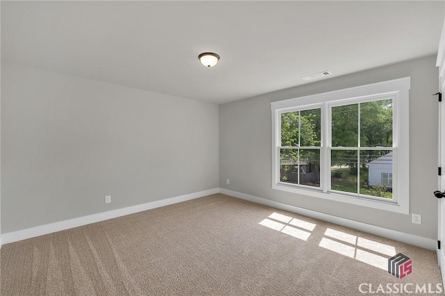 231 Marable St E, Monroe, GA 30655 - carpeted spare room featuring baseboards