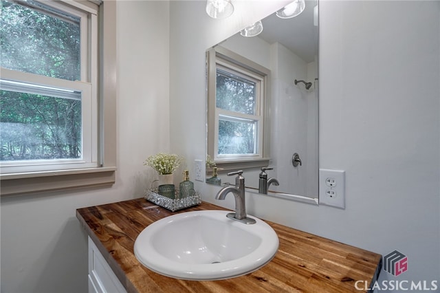 1210 Burr Harris Rd, Watkinsville, GA 30677 - bathroom featuring vanity, healthy amount of natural light, and a shower