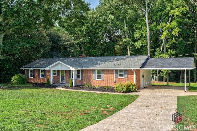 1210 Burr Harris Rd, Watkinsville, GA 30677 - single story home with concrete driveway, an attached carport, brick siding, a front lawn, and view of wooded area