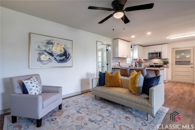 1210 Burr Harris Rd, Watkinsville, GA 30677 - living room featuring light wood finished floors, recessed lighting, a ceiling fan, and baseboards
