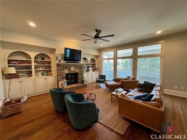 64 Charter Oak Dr, Athens, GA 30607 - living room featuring crown molding, a ceiling fan, a stone fireplace, wood finished floors, and built in features