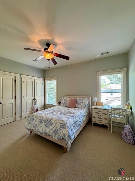 64 Charter Oak Dr, Athens, GA 30607 - bedroom featuring multiple windows, carpet, and a ceiling fan