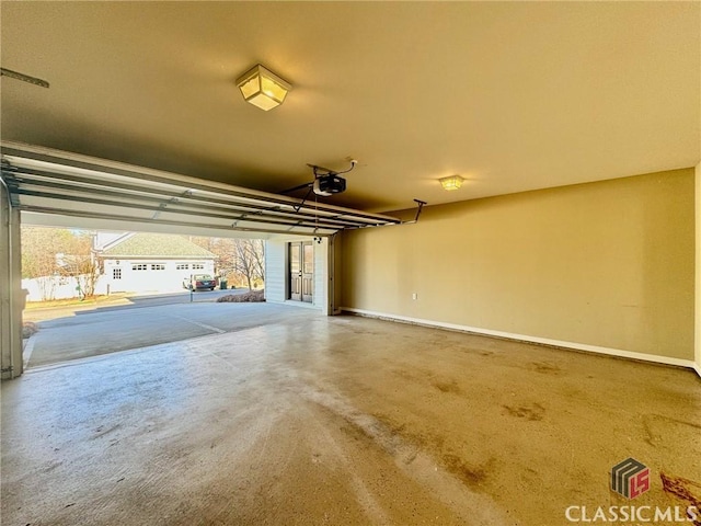 64 Charter Oak Dr, Athens, GA 30607 - garage featuring a garage door opener, baseboards, and french doors