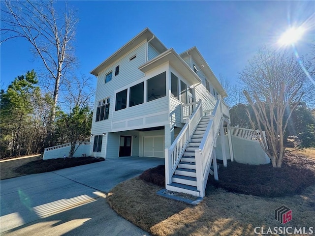 64 Charter Oak Dr, Athens, GA 30607 - view of front of property with a garage, a sunroom, driveway, and stairs
