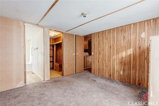 1200 Burr Harris Rd, Watkinsville, GA 30677 - unfurnished bedroom with carpet, wooden walls, and ensuite bath