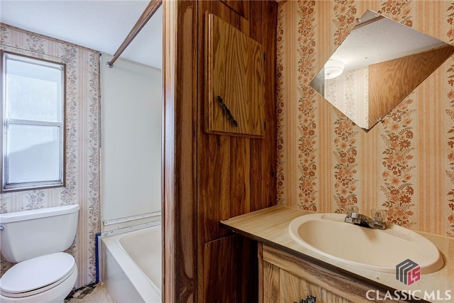 1200 Burr Harris Rd, Watkinsville, GA 30677 - bathroom featuring wallpapered walls, toilet, vanity, and shower / washtub combination