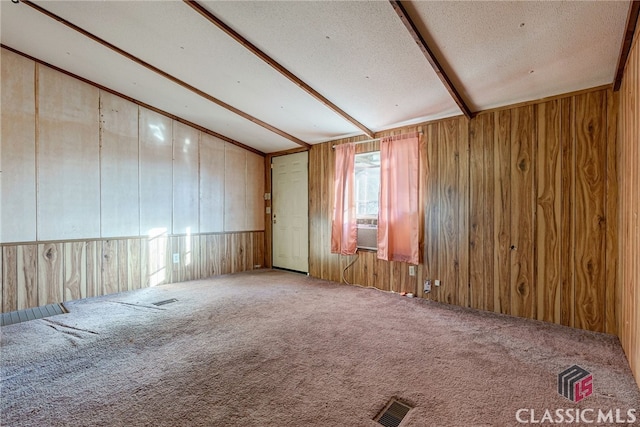 1200 Burr Harris Rd, Watkinsville, GA 30677 - carpeted empty room with vaulted ceiling, wooden walls, and a textured ceiling