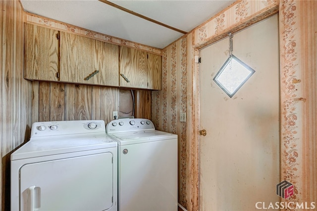 1200 Burr Harris Rd, Watkinsville, GA 30677 - laundry area with cabinet space, washer and dryer, and wallpapered walls