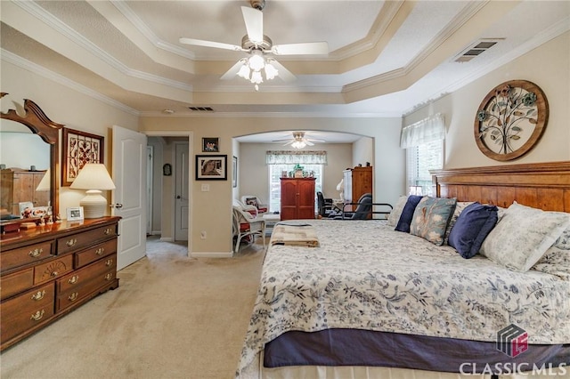 1663 Oconee Pt, Jefferson, GA 30549 - bedroom with multiple windows, a raised ceiling, light carpet, crown molding, and arched walkways
