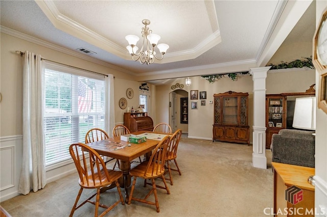 1663 Oconee Pt, Jefferson, GA 30549 - dining area with a tray ceiling, a chandelier, light carpet, ornamental molding, and wainscoting