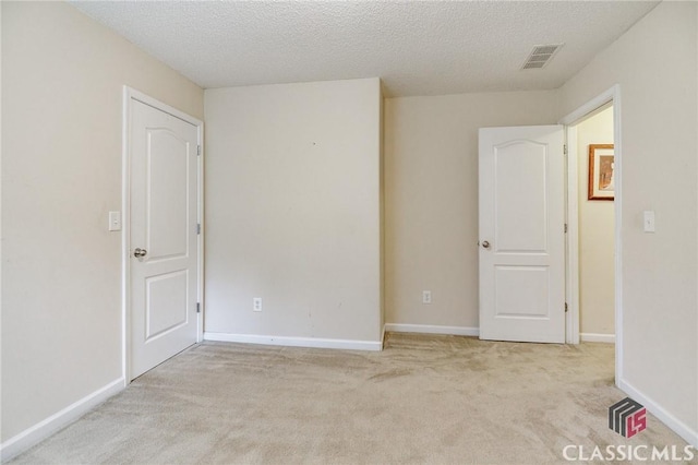 1663 Oconee Pt, Jefferson, GA 30549 - empty room featuring light carpet and a textured ceiling