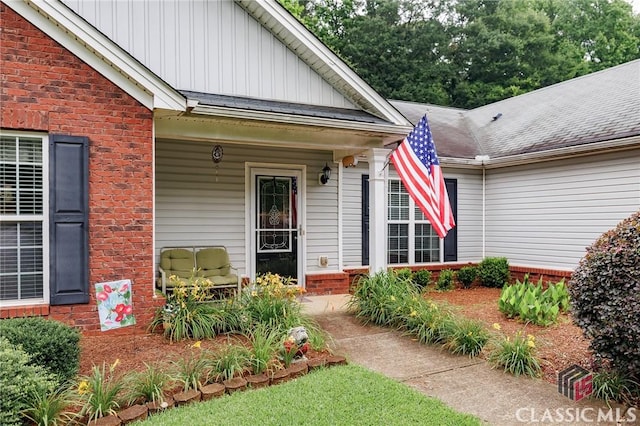 1663 Oconee Pt, Jefferson, GA 30549 - entrance to property with board and batten siding, brick siding, and roof with shingles