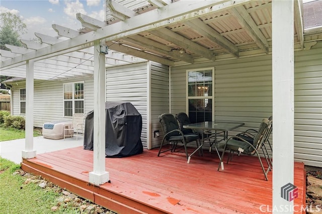 1663 Oconee Pt, Jefferson, GA 30549 - wooden deck featuring a pergola, outdoor dining space, and area for grilling