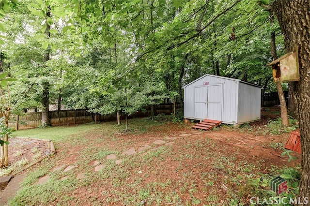 1663 Oconee Pt, Jefferson, GA 30549 - fenced backyard with a storage shed