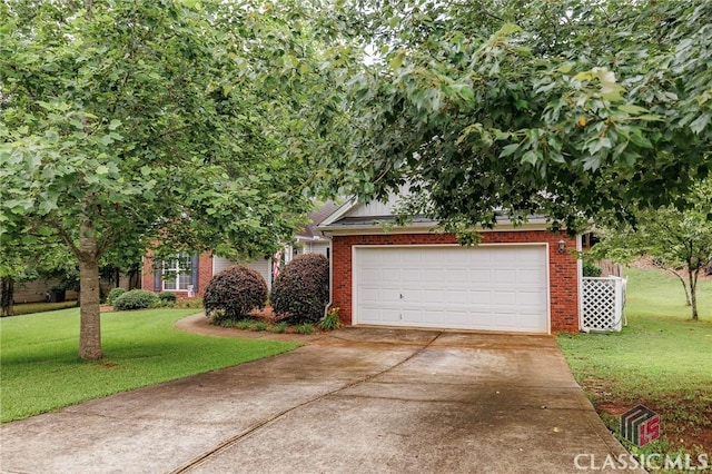 1663 Oconee Pt, Jefferson, GA 30549 - view of property hidden behind natural elements featuring driveway, brick siding, a front yard, and a garage