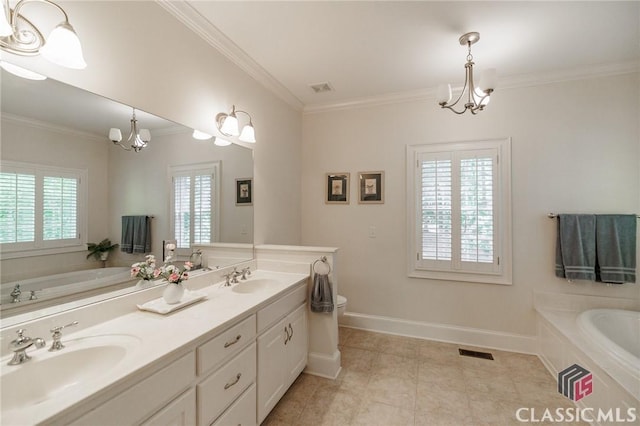 1181 Knob Creek Dr, Athens, GA 30606 - bathroom featuring a chandelier, ornamental molding, a garden tub, and healthy amount of natural light