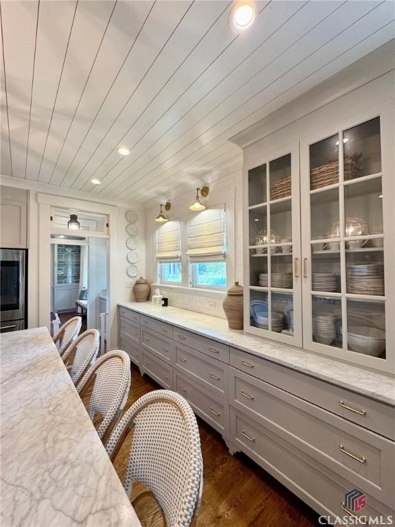 125 Woodland Way, Athens, GA 30606 - kitchen with gray cabinetry, dark wood-style floors, glass insert cabinets, and recessed lighting