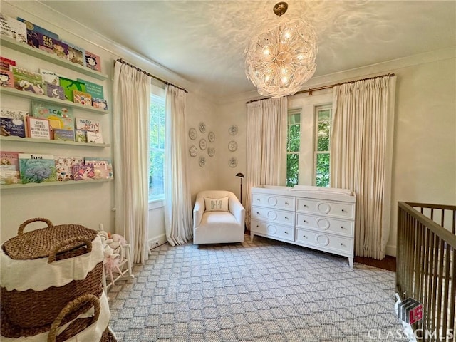125 Woodland Way, Athens, GA 30606 - bedroom with a nursery area, a chandelier, crown molding, carpet, and baseboards