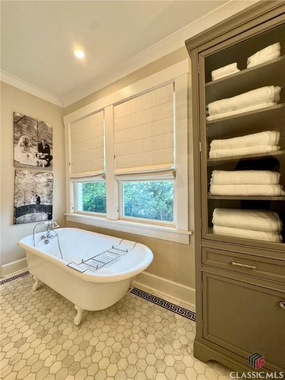 125 Woodland Way, Athens, GA 30606 - bathroom featuring baseboards, ornamental molding, and a soaking tub